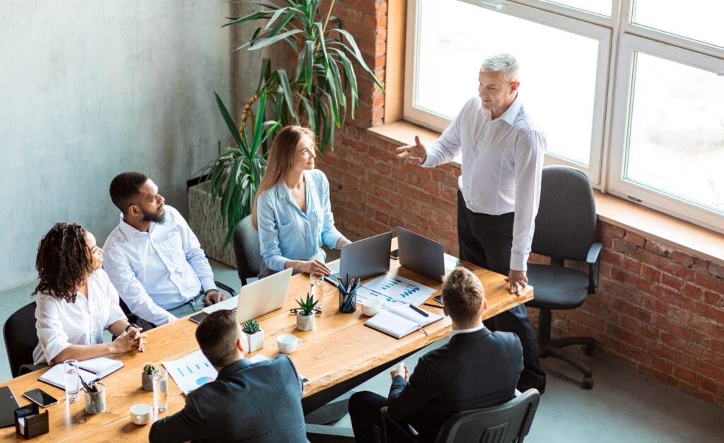 Recruitment consultants discussing IT recruitment services in meeting room